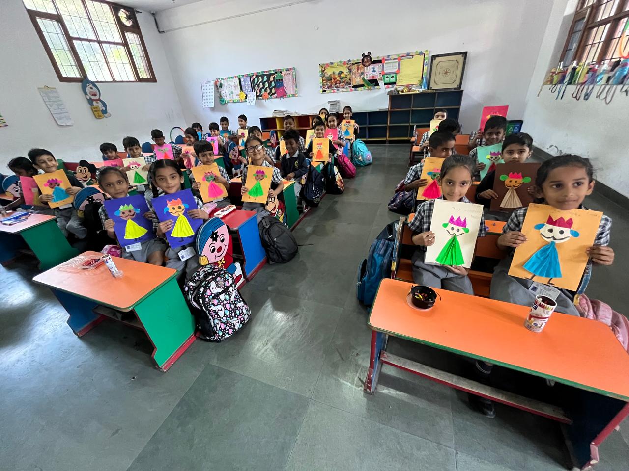 Students making colourful Dussehra artwork