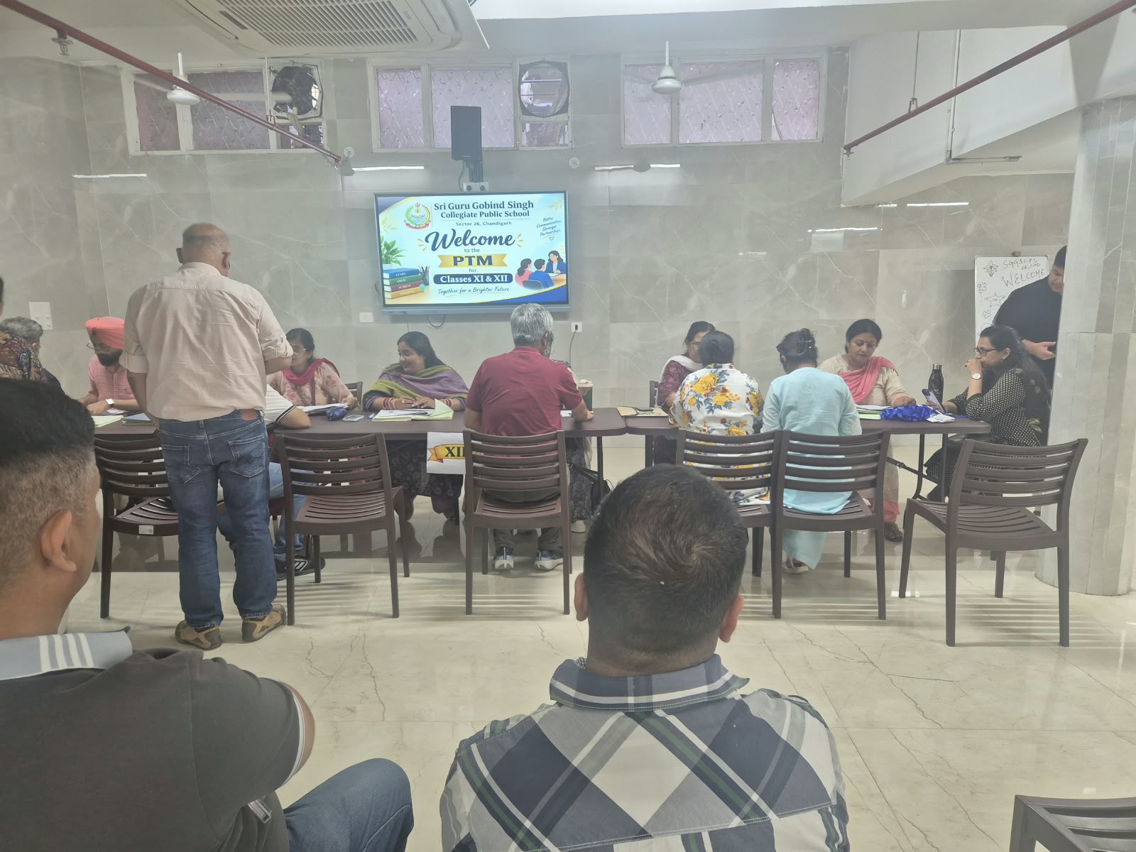 Parents and teachers discussing student progress