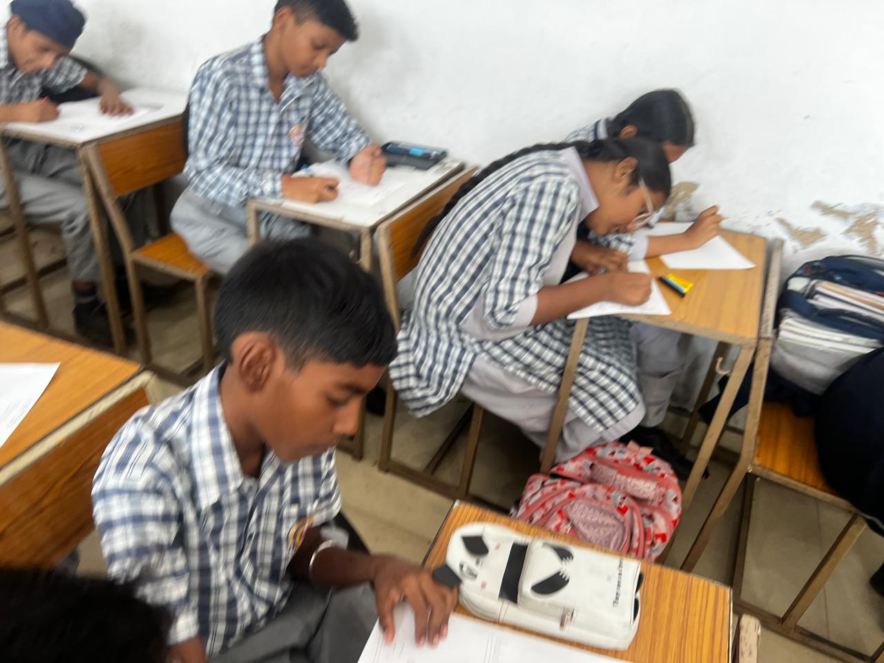 Students preparing colourful e-waste posters