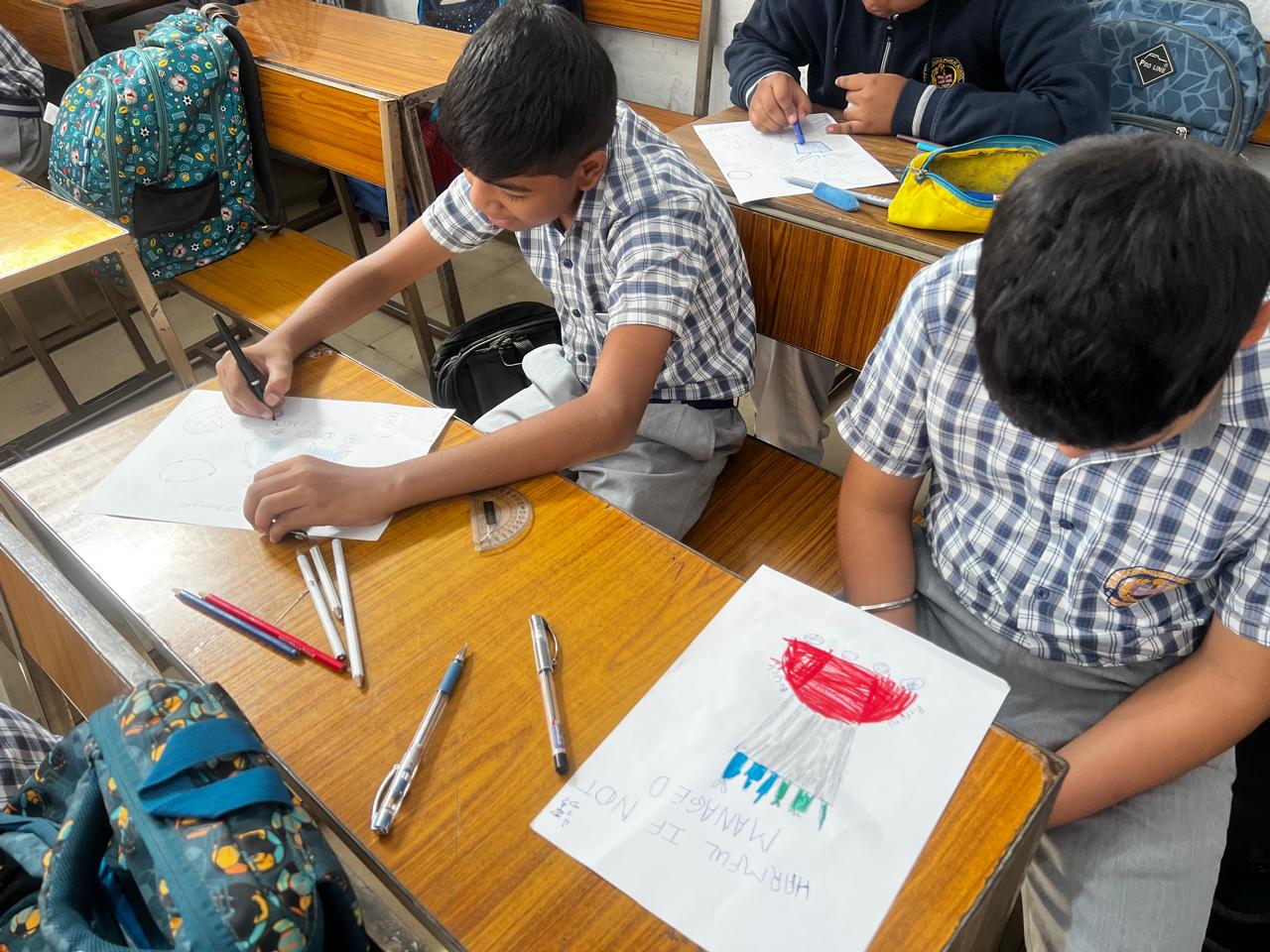 Students working together on posters