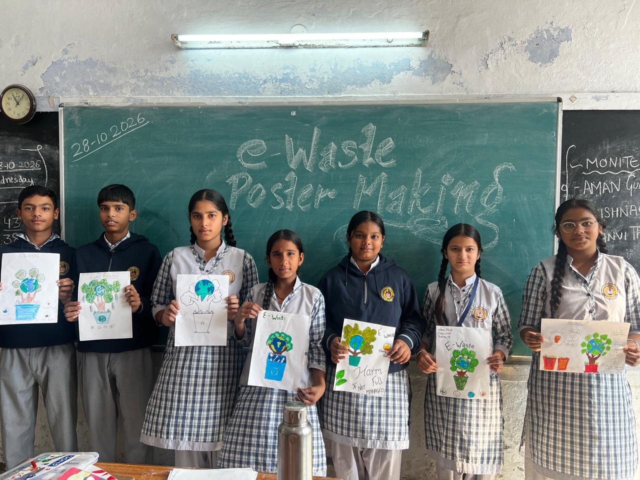 Students displaying their completed awareness posters