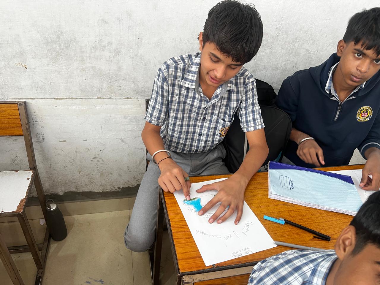 Student completing a poster during the activity
