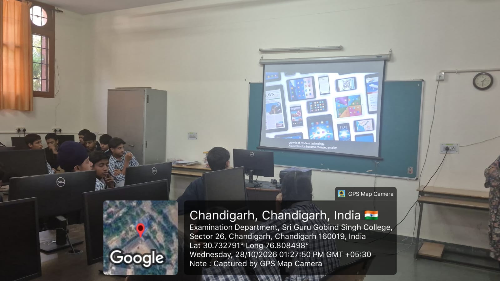 Students watching an e-waste documentary in the classroom