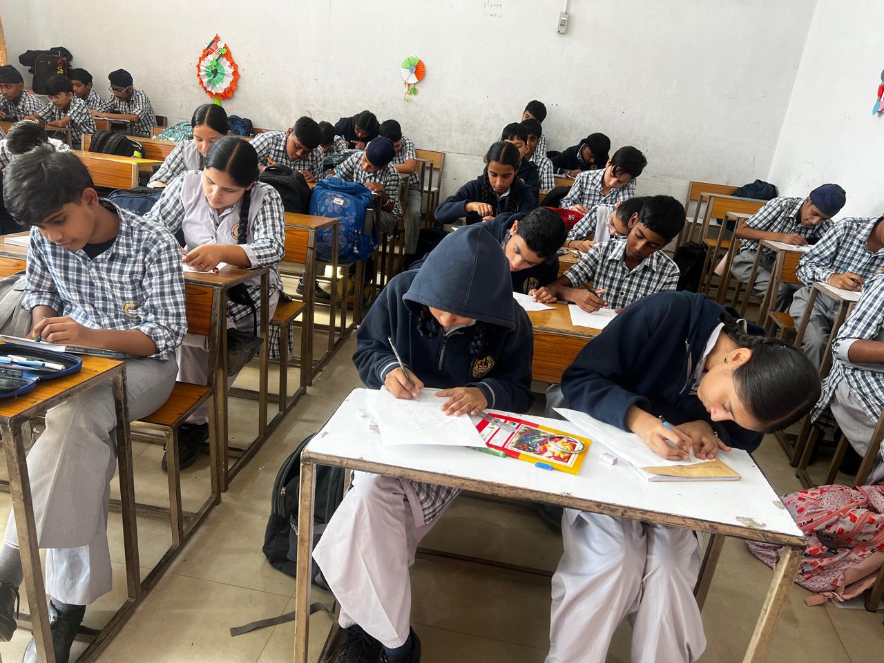 Students participating in the poster making competition