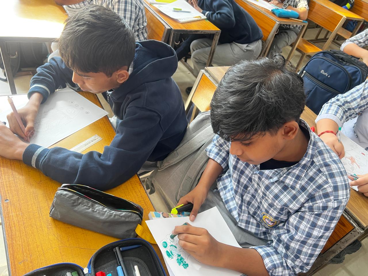 Students designing posters about electronic waste