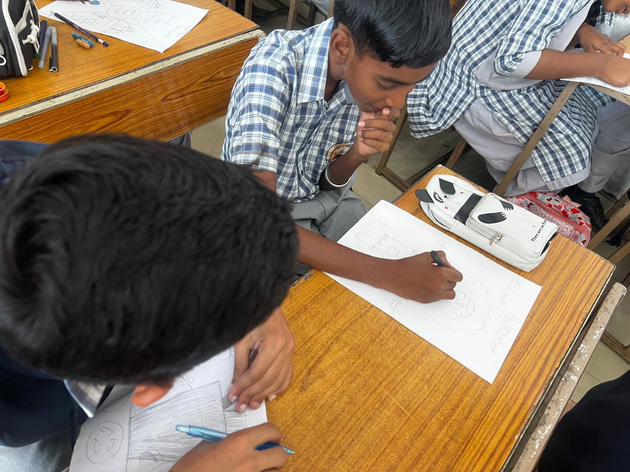 Close-up of a student preparing an awareness poster